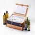 Open UPS shipping box containing wrapped olive oil bottles and packing materials. - Olive Oil Times