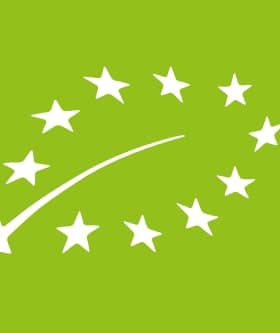 Logo representing the European Union organic certification with stars and a curved line on a green background. - Olive Oil Times