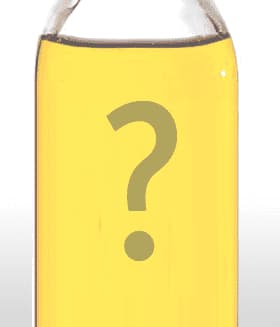 Transparent bottle filled with yellow oil featuring a large question mark in the center. - Olive Oil Times