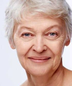Close-up portrait of an older woman with short gray hair and a neutral expression. - Olive Oil Times
