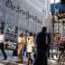 The exterior of The New York Times building with its name displayed prominently on the facade. - Olive Oil Times