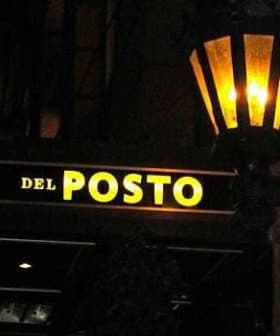 Illuminated sign reading 'Del Posto' with a lantern above it. - Olive Oil Times