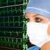 Healthcare professional in a surgical mask observing heart rate monitor with ECG readings in the background. - Olive Oil Times