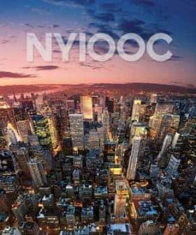 Aerial view of New York City skyline during sunset with vibrant colors in the sky. - Olive Oil Times