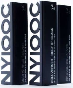 Three black award trophies for the New York International Olive Oil Competition with silver and best of class labels. - Olive Oil Times
