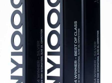 Three black award trophies for the New York International Olive Oil Competition with silver and best of class labels. - Olive Oil Times