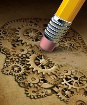 Illustration of a pencil eraser removing gears from a brain, symbolizing thought processes. - Olive Oil Times