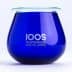 Blue glass container with the logo of The International Olive Oil School printed on it. - Olive Oil Times