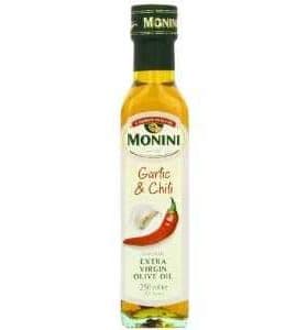 Bottle of Monini Garlic and Chili Extra Virgin Olive Oil with a red chili pepper design. - Olive Oil Times