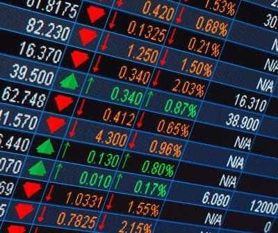 Stock market ticker displaying various stock prices with green and red indicators for changes. - Olive Oil Times