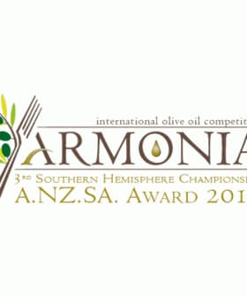 Logo for the Armonia International Olive Oil Competition featuring olive branches and a droplet. - Olive Oil Times