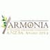 Logo for the Armonia International Olive Oil Competition featuring olive branches and a droplet. - Olive Oil Times