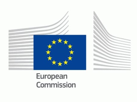 Logo of the European Commission featuring a blue background with yellow stars and stylized building outlines. - Olive Oil Times