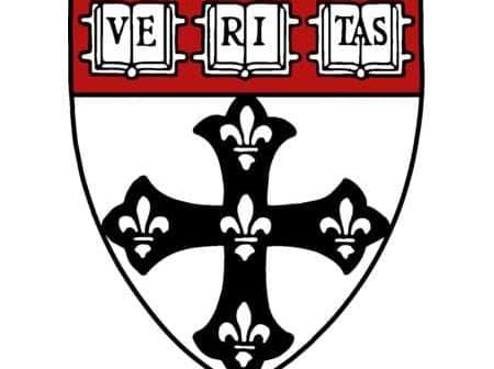 Coat of arms of Harvard University featuring a black cross and the word 'Veritas'. - Olive Oil Times