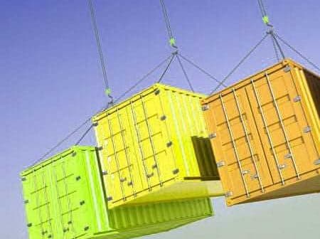 Three shipping containers in yellow, green, and orange suspended from cables against a blue sky. - Olive Oil Times