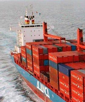 A large container ship with stacked cargo containers navigating through the ocean. - Olive Oil Times