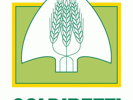 Logo of Coldiretti featuring a stylized wheat sheaf and spade design. - Olive Oil Times
