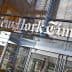 Entrance sign of The New York Times building with the name displayed prominently. - Olive Oil Times