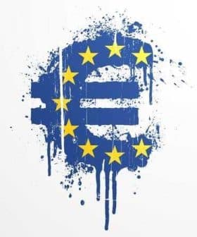Graffiti art featuring the Euro symbol with blue background and yellow stars. - Olive Oil Times