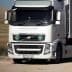 White Volvo truck with Nargourmet branding and green circular symbols on the front. - Olive Oil Times