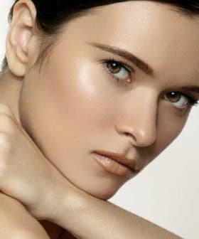 Close-up portrait of a woman with light skin and green eyes, looking directly at the camera. - Olive Oil Times