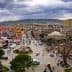 Aerial view of a Turkish town featuring a clock tower and surrounding buildings. - Olive Oil Times