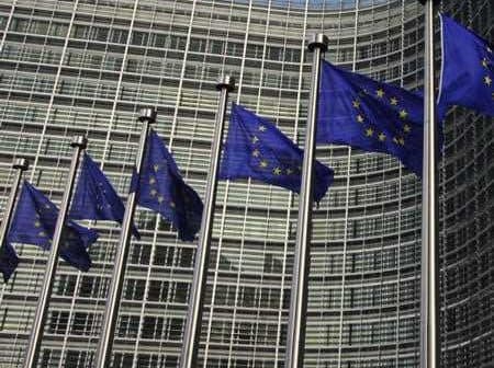 European Union flags displayed in front of the European Commission building in Brussels. - Olive Oil Times
