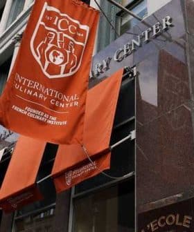 Exterior view of the International Culinary Center with banners displaying its name and founding details. - Olive Oil Times