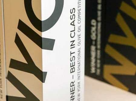 Packaging for the New York International Olive Oil Competition with 'Winner - Best in Class' text. - Olive Oil Times