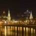 Night view of the Moscow Kremlin with illuminated towers and buildings along the river. - Olive Oil Times