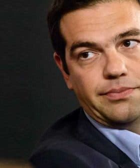 Close-up portrait of a man with dark hair wearing a suit and looking to the side. - Olive Oil Times