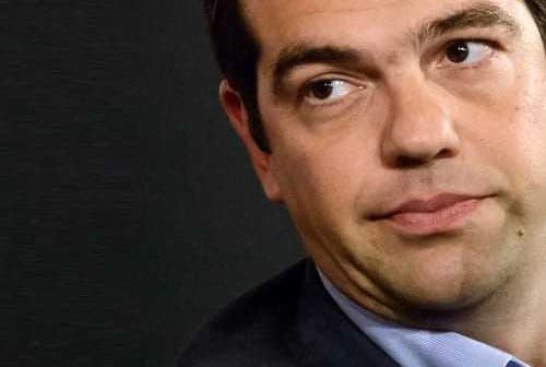Close-up portrait of a man with dark hair wearing a suit and looking to the side. - Olive Oil Times