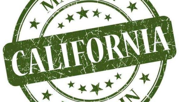 Green circular stamp with the text 'Made in California' and stars in a distressed style. - Olive Oil Times