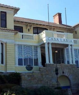 Exterior view of Casa Labia, a yellow building with decorative features and columns. - Olive Oil Times