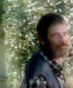 A man with a beard and a woman smiling, both appearing in a natural outdoor setting. - Olive Oil Times