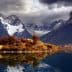 Mountain landscape featuring peaks and a lake reflecting the scenery in Torres del Paine National Park. - Olive Oil Times