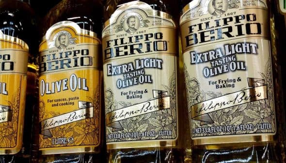 Various bottles of Filippo Berio olive oil, including extra light and extra virgin varieties. - Olive Oil Times