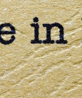 Text that reads 'Made in Italy' with green, white, and red colors representing the Italian flag. - Olive Oil Times