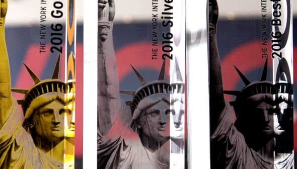 Three award trophies featuring the Statue of Liberty design for the 2016 New York International Olive Oil Competition. - Olive Oil Times