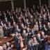 Members of the U.S. Congress standing and applauding during a session in the House chamber. - Olive Oil Times