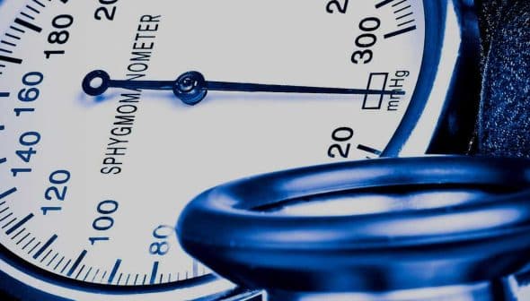 Close-up of a sphygmomanometer displaying blood pressure readings in mmHg. - Olive Oil Times