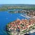Aerial view of Korčula Island featuring the town and surrounding sea with boats. - Olive Oil Times