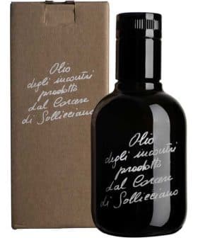 Black glass bottle of olive oil with a cardboard box featuring handwritten text. - Olive Oil Times