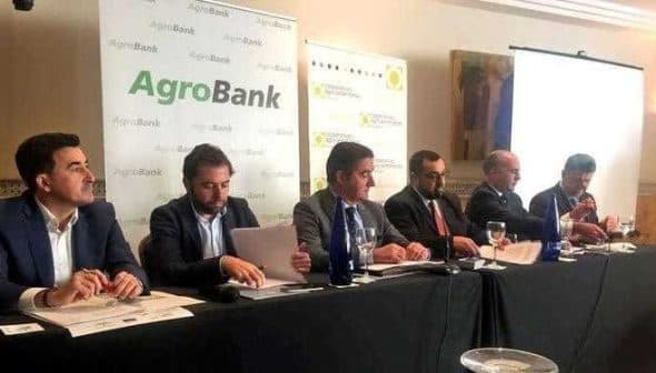 Panel of six individuals seated at a table during an AgroBank press conference. - Olive Oil Times