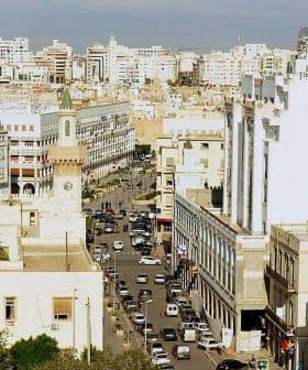 A panoramic view of the city of Sfax, featuring buildings and streets under a clear sky. - Olive Oil Times
