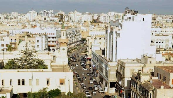 A panoramic view of the city of Sfax, featuring buildings and streets under a clear sky. - Olive Oil Times