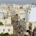 A panoramic view of the city of Sfax, featuring buildings and streets under a clear sky. - Olive Oil Times