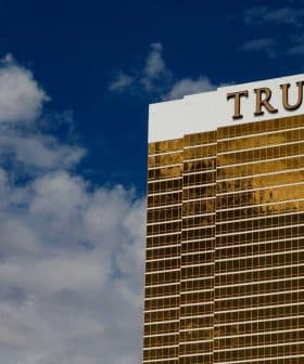 Trump International Hotel and Tower, a tall golden building with the name 'TRUMP' prominently displayed on top. - Olive Oil Times