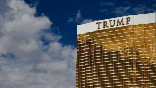 Trump International Hotel and Tower, a tall golden building with the name 'TRUMP' prominently displayed on top. - Olive Oil Times