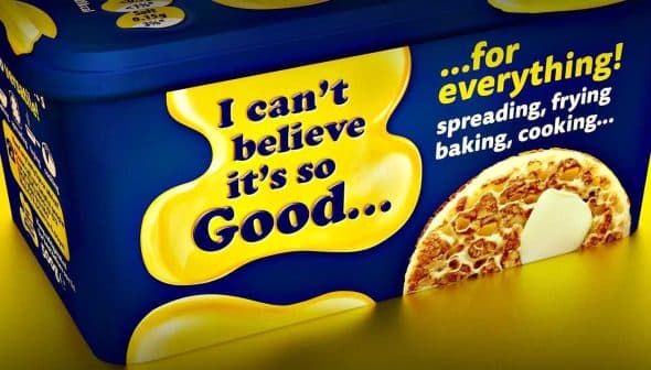 Container of a butter substitute with a yellow and blue design featuring text about its uses. - Olive Oil Times